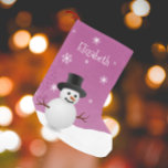 Pink Snowman Winter Scene Christmas Stocking<br><div class="desc">Bring classic holiday cheer to your home with this Pink Snowman Winter Scene Personalised Stocking. Featuring a charming snowman and top hat surrounded by falling snow and delicate white snowflakes, this design captures the magic of a snowy winter scene. Accented with festive holiday typography and a warm Merry Christmas greeting,...</div>