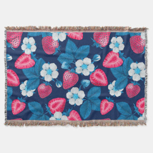 Pink strawberries on blue throw blanket