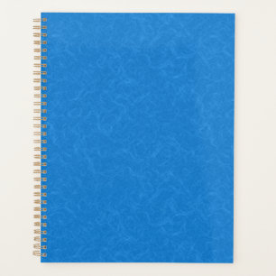 Pink textured surface with subtle swirling pattern planner