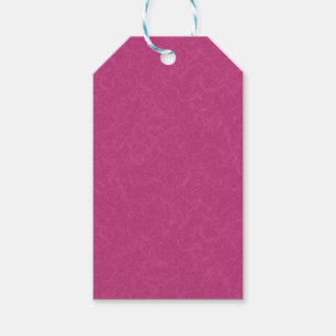 Pink textured surface with swirling pattern gift tags