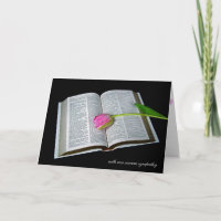 pink tulip on Holy Bible sympathy