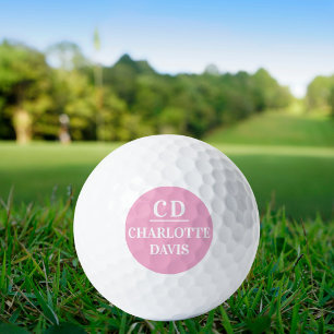 Pink white monogram initials name golf balls