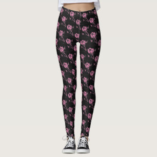 Pink woodcut tiled rose on a black background leggings