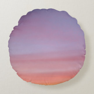 Pink, yellow, and purple cloudy sky round cushion