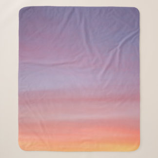 Pink, yellow, and purple cloudy sky sherpa blanket