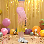 Pink Yellow Gold Glitter Ombre Sparkle Capri Leggings<br><div class="desc">Pink Gold Yellow Glitter Ombre Sparkle Capri Leggings with Faux Pink Yellow Glitter background and name in black. Use personalise this template option to change the text | Use customise further option to change the text style, size and colour if required. If you don’t need text, delete it.</div>