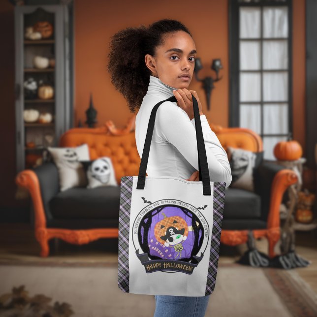 Pirate skeleton cat and plaid tote bag (A woman shows the Pirate skeleton cat and plaid tote bag.)