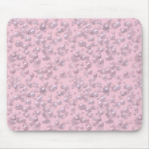 Placers of white-pink pearls on pink velvet mouse pad