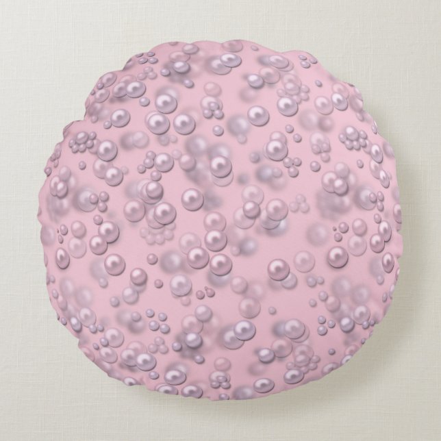 Placers of white-pink pearls on pink velvet round cushion (Front)