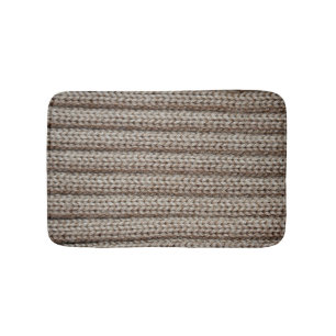 Plain knitted fabric, brown texture. bath mat