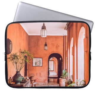 PLANTERS WITH PLANT NEAR AREA RUG INSIDE ROOM LAPTOP SLEEVE