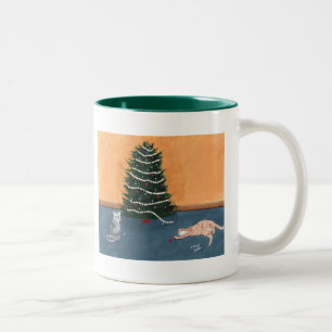 Playful Christmas cats by the tree Mug