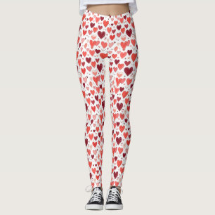 Playful hand drawn red hearts pattern on white leggings