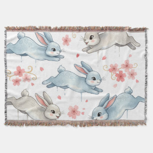 Playful Rabbits in a Blooming Dream Throw Blanket