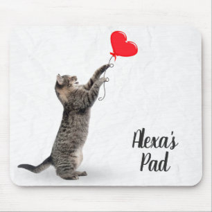 playful tabby cat with heart balloon mouse pad