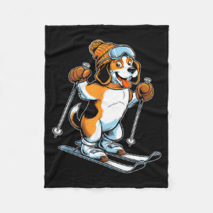 Playful winter beagle with skiing fleece blanket