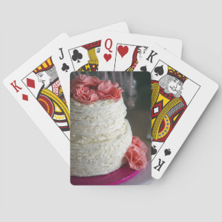 Playing Cards with pink and white cake on the back