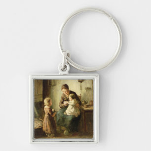 Playing with baby, 19th century key ring