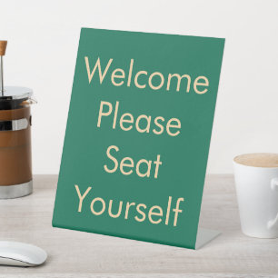Please Seat Yourself Green Pedestal Sign