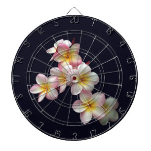 Plumeria blossoms on dark blue dartboard