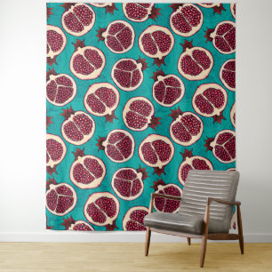 Pomegranate slices on turquoise tapestry