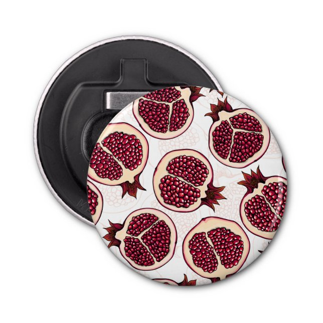 Pomegranate slices on white bottle opener (Front)