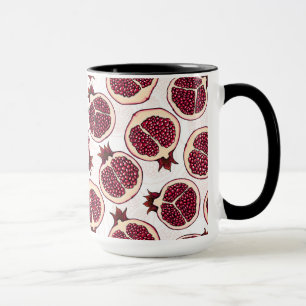 Pomegranate slices on white mug