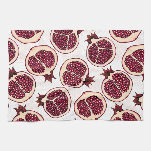 Pomegranate slices on white tea towel (Horizontal)