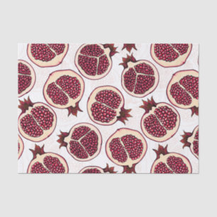 Pomegranate slices on white tissue paper
