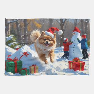 Pomeranian Running in Snow with Christmas Hat Tea Towel