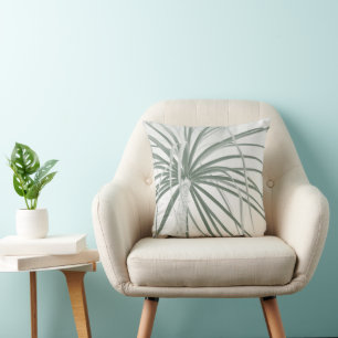 Ponytail palm foliage on white cushion
