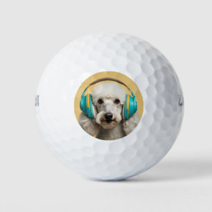 Poodle wearing headphones golf balls