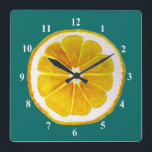 Pop art yellow lemon fruit original watercolour square wall clock<br><div class="desc">A cute and colorful vibrant yellow lemon fruit slice from an original painting by artist Sacha Grossel. This large pop art style fruit is yellow and very bright and colorful against a customizable blue teal colored background. Quirky and original.</div>