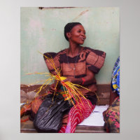 Portrait of pretty Ugandan woman weaving mat