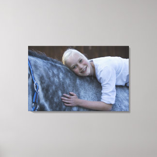 portrait of young girl on white horse canvas print