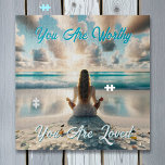 Positive Affirmation | I am Worthy of Love Jigsaw Puzzle<br><div class="desc">Puzzle with a positive affirmations quote. You are worthy,  you are loved. Ai art illustration of a woman meditating by the clear blue ocean waves,  surrounded by sea glass,  on a sandy beach,  with beautiful clouds floating in the sky.</div>