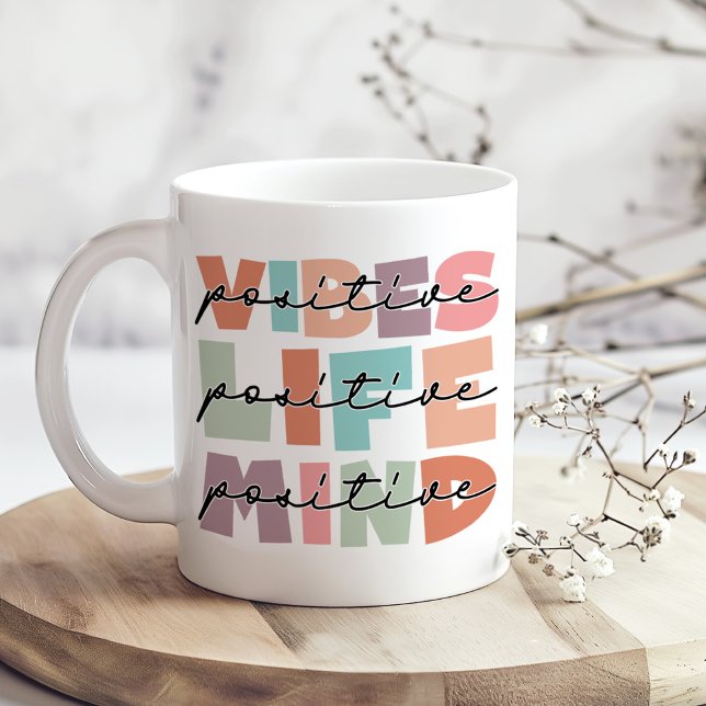 Positive Vibes Positive Life Inspirational Coffee Mug (Positive Vibes Positive Life Inspirational Coffee Mug on a boho kitchen table with tiny white flower)