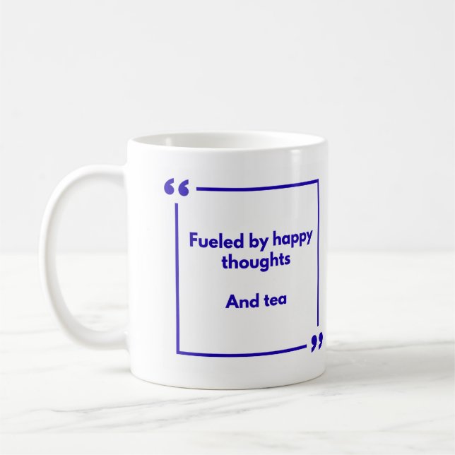 Positivity mug - Fuelled by happy thoughts, and te (Left)