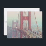 Postcard<br><div class="desc">The image shows a partial view of the Golden Gate Bridge in San Francisco, shrouded in fog. The bridge's distinctive red-orange colour is visible, contrasting with the grey fog. Cars are seen driving on the bridge. The background features blurred hills and sky due to the fog. The overall mood is...</div>