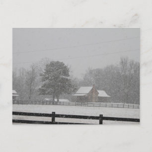Postcard  Snow falling on a farm.