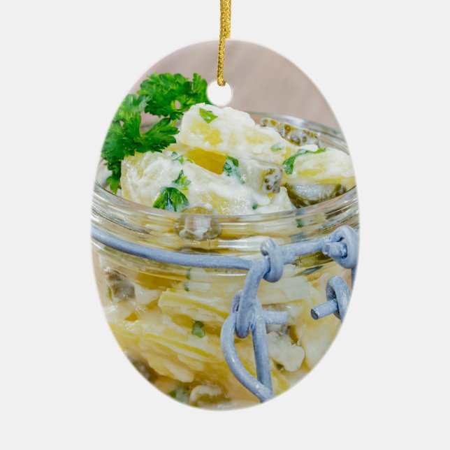 Potato salad in a jar on wooden ceramic tree decoration (Front)