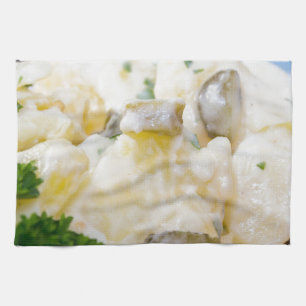 Potato salad with sausage and mustard tea towel