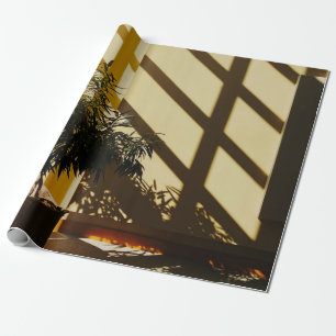 Potted green plant on brown wooden table wrapping paper