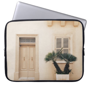 Potter plant near concrete house laptop sleeve