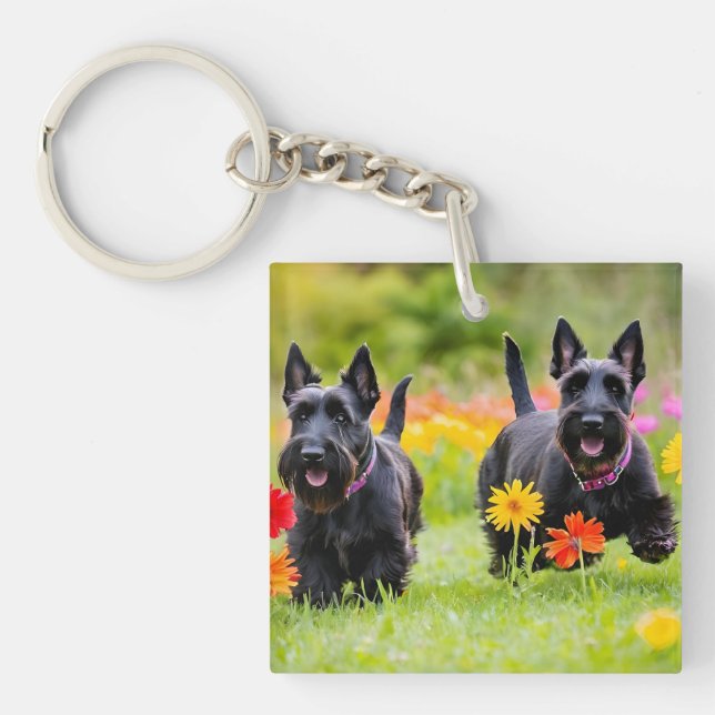 Prancing Scottish Terriers in grass and flowers Key Ring (Front)