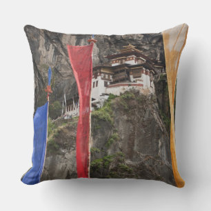 Prayer flags hang near Taktshang Cushion