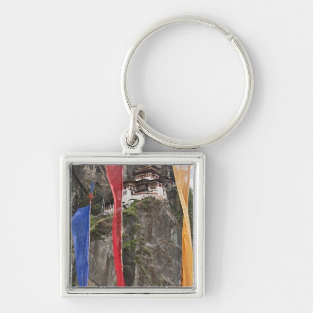 Prayer flags hang near Taktshang Key Ring (Front)