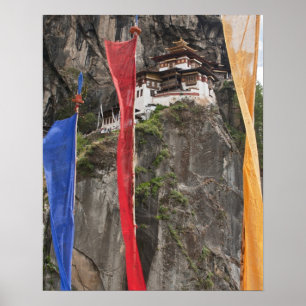 Prayer flags hang near Taktshang Poster