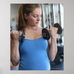 pregnant woman exercising at health club poster