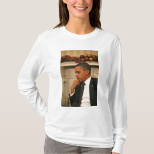 President Barack Obama reflects as he meets T-Shirt